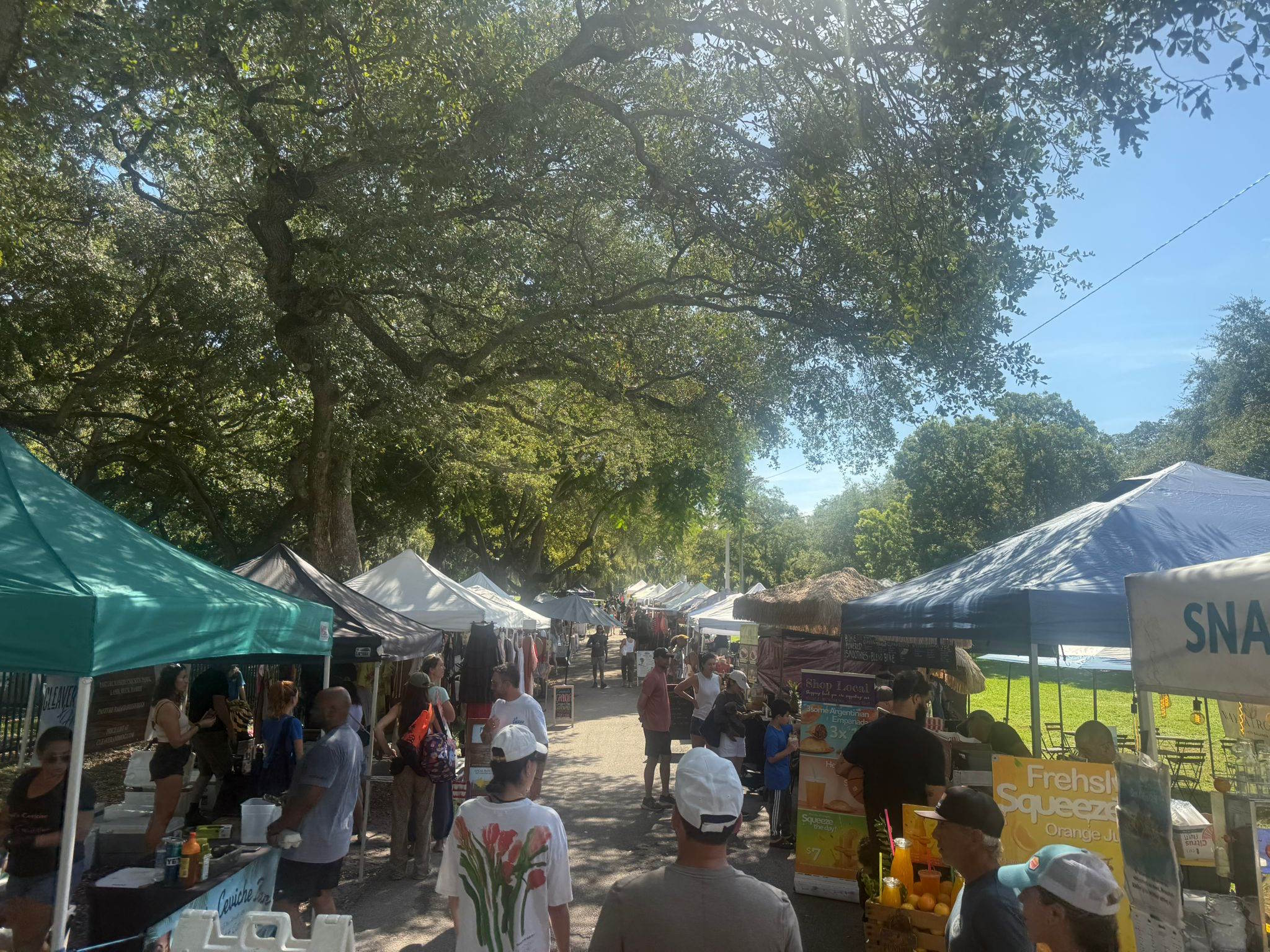 Vendor tents and fresh produce at Legion Park farmers market